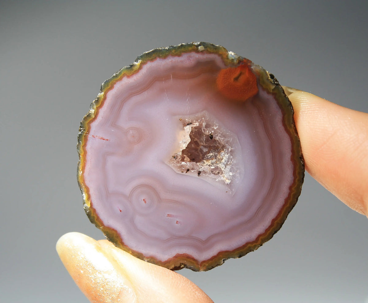 Banded purple Zhanguo agate pair with vivid swirling layers