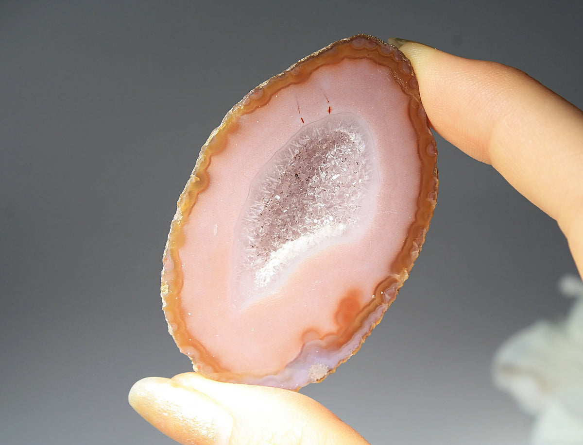 Vibrant pink Zhanguo agate pair with delicate layered patterns