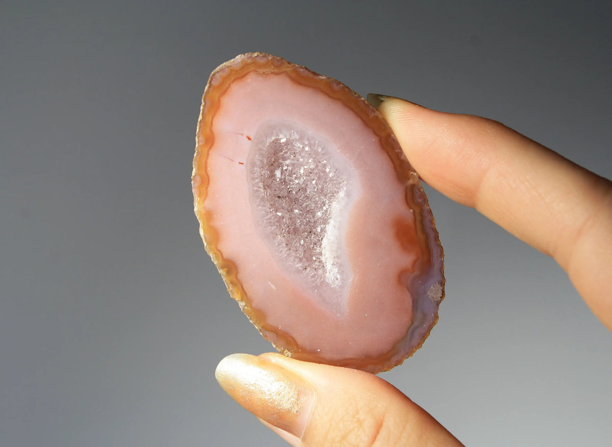 Vibrant pink Zhanguo agate pair with delicate layered patterns