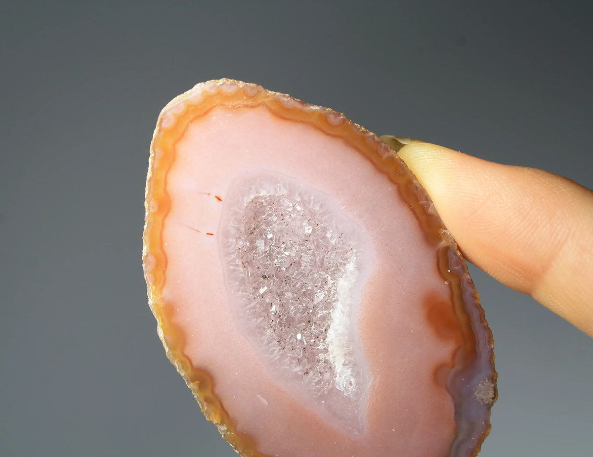 Vibrant pink Zhanguo agate pair with delicate layered patterns