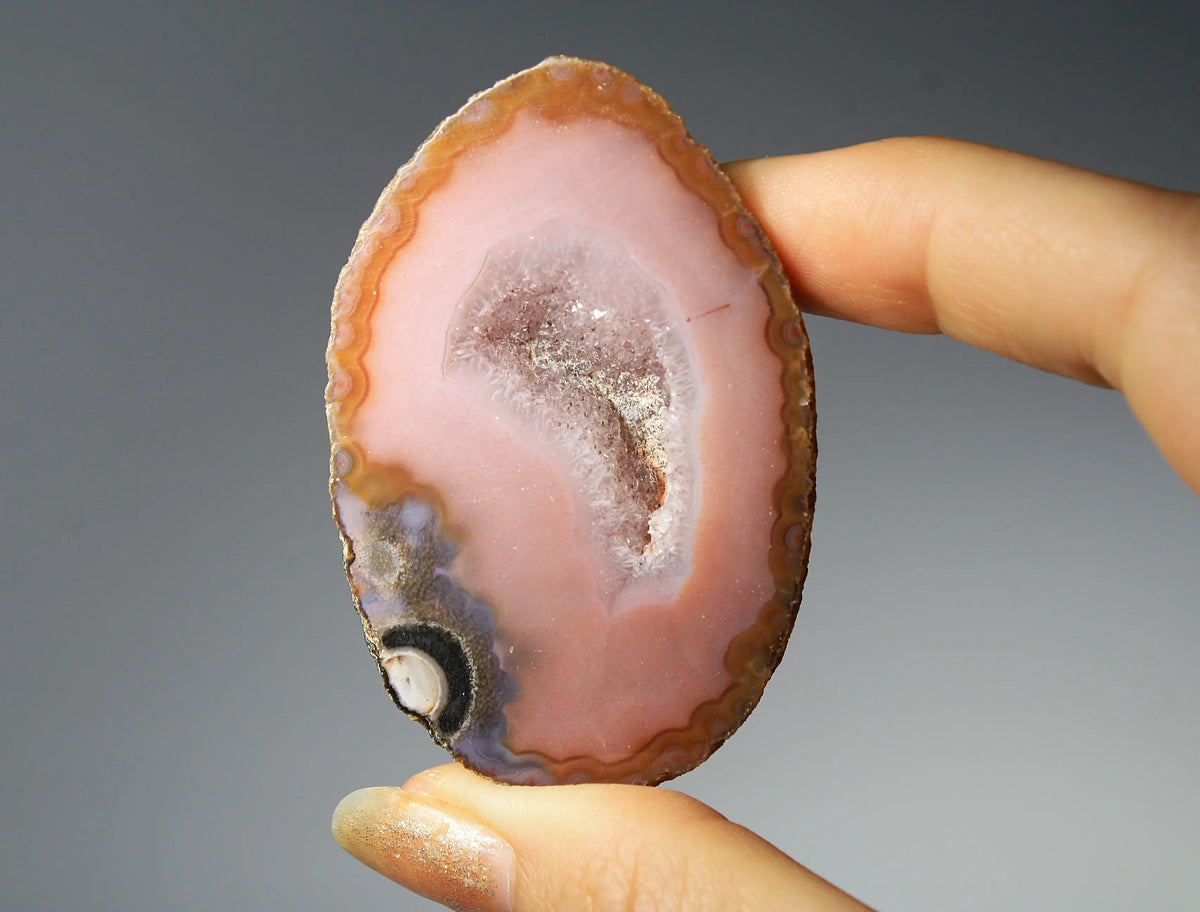 Vibrant pink Zhanguo agate pair with delicate layered patterns