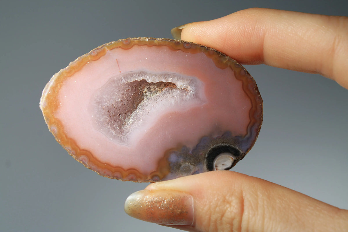 Vibrant pink Zhanguo agate pair with delicate layered patterns