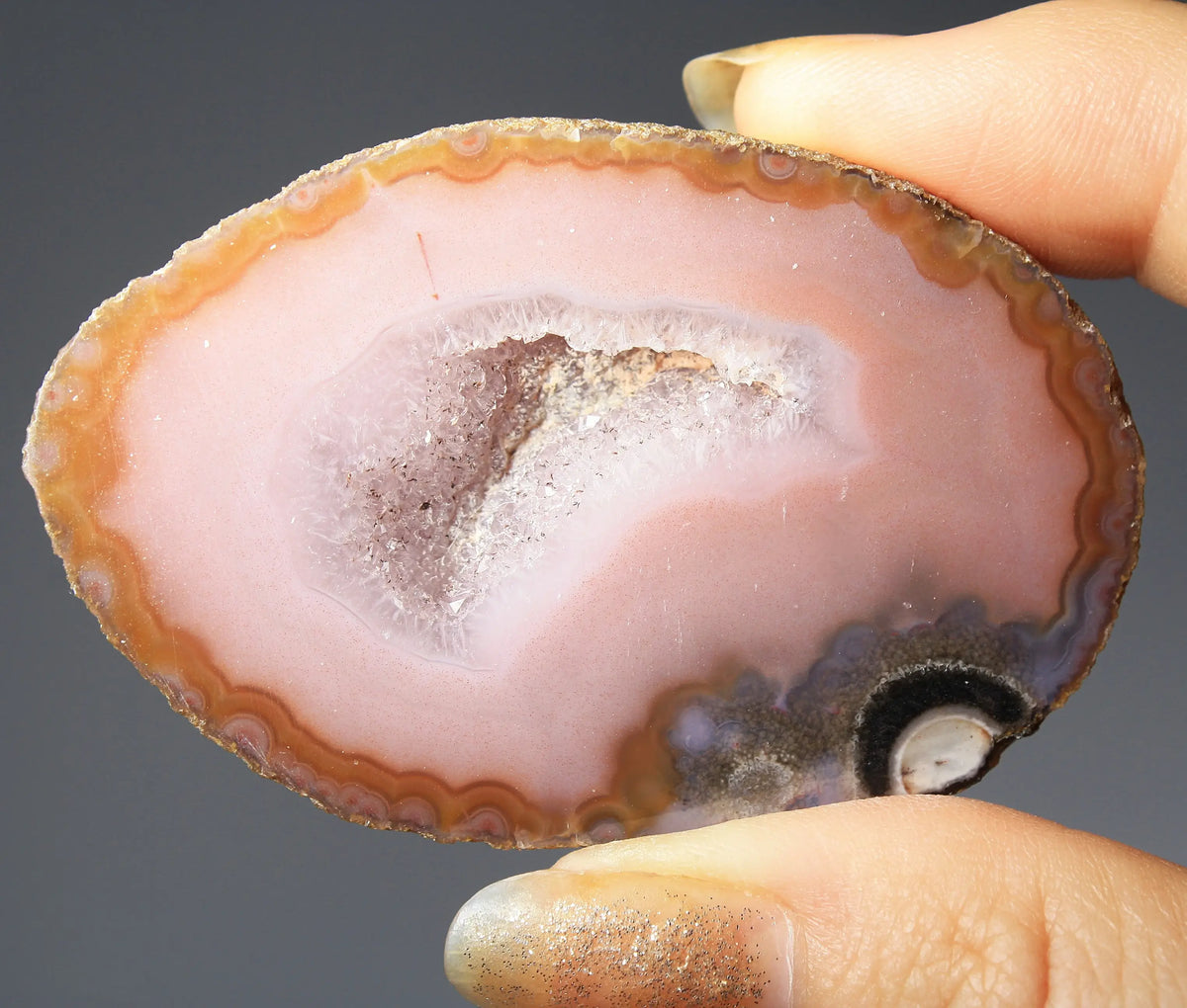 Vibrant pink Zhanguo agate pair with delicate layered patterns
