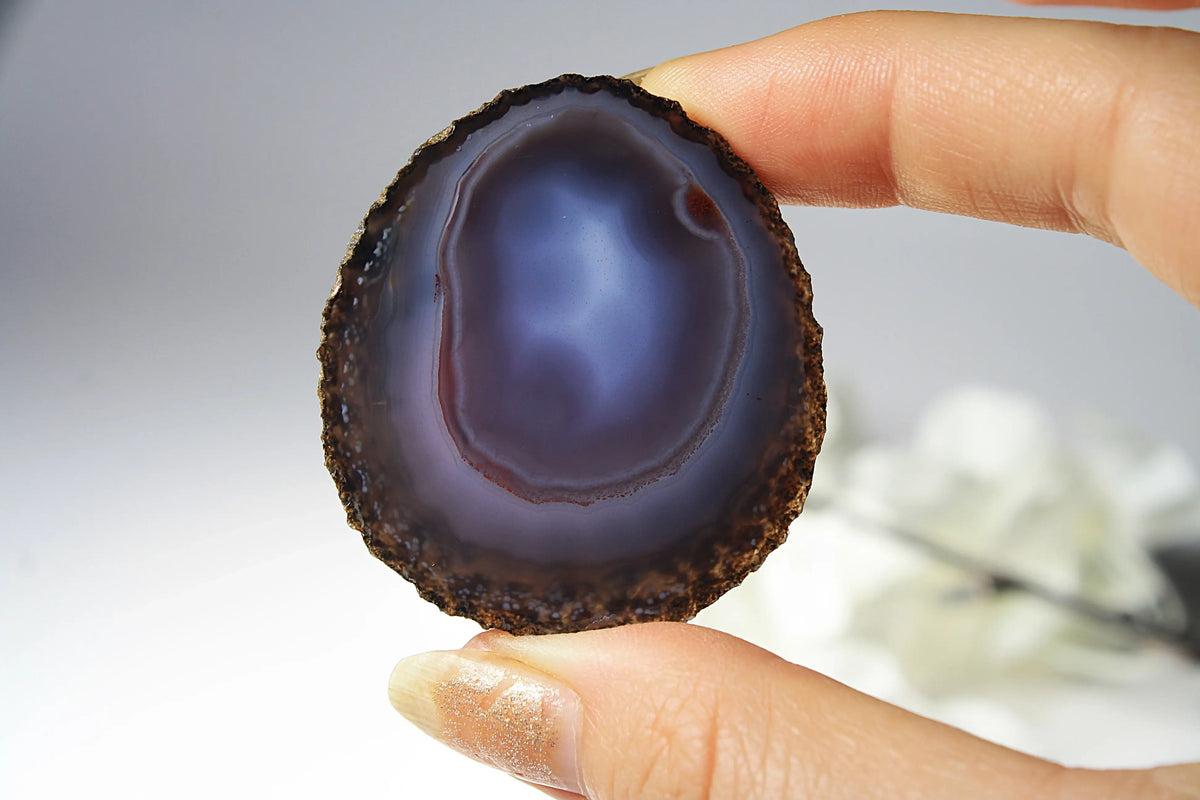 Mysterious purple-blue banded Zhanguo agate pair glowing with depth