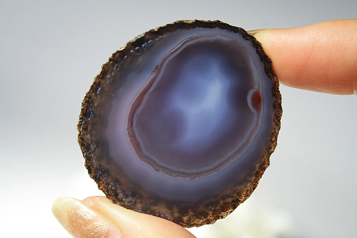 Mysterious purple-blue banded Zhanguo agate pair glowing with depth