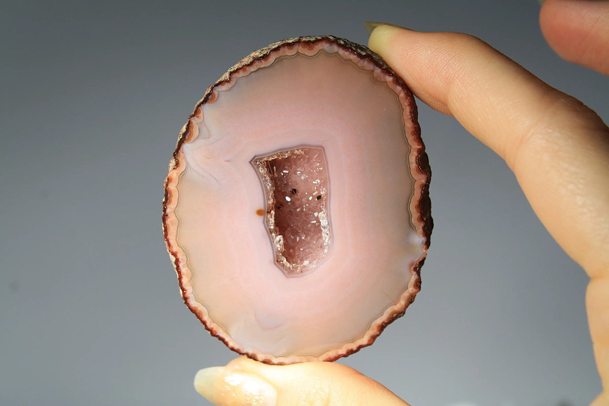 Delicate pink Zhanguo agate pair with layered, gentle bands