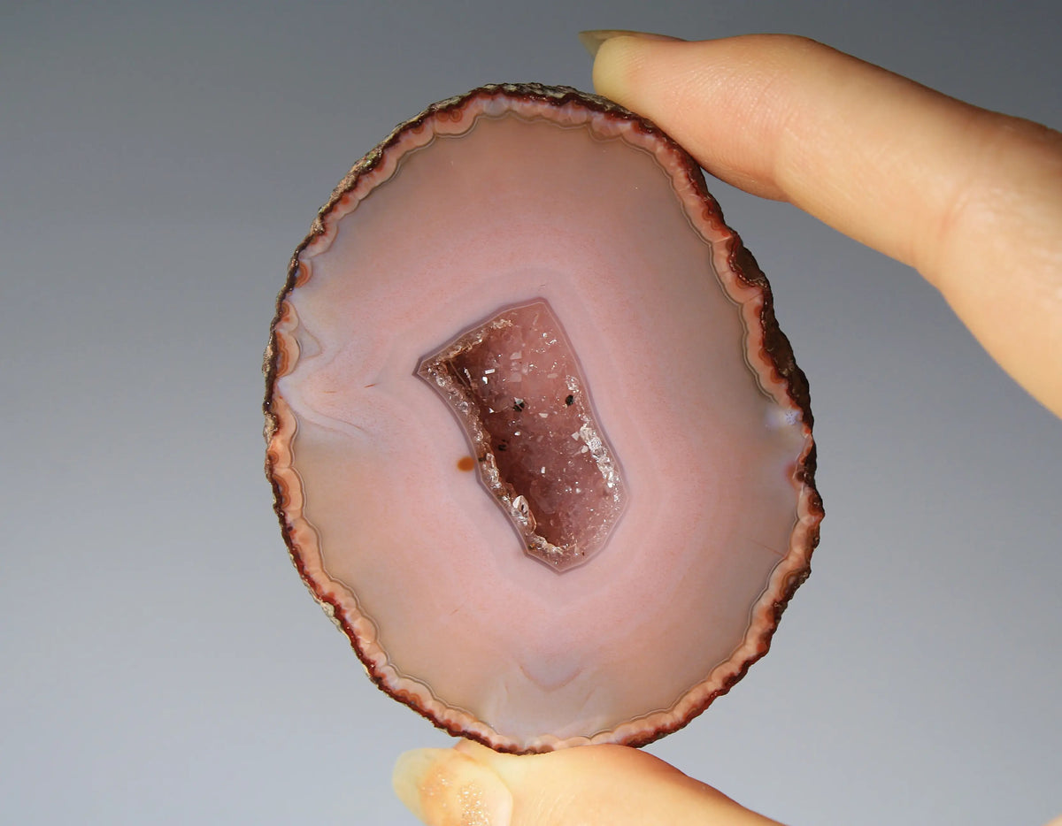Delicate pink Zhanguo agate pair with layered, gentle bands