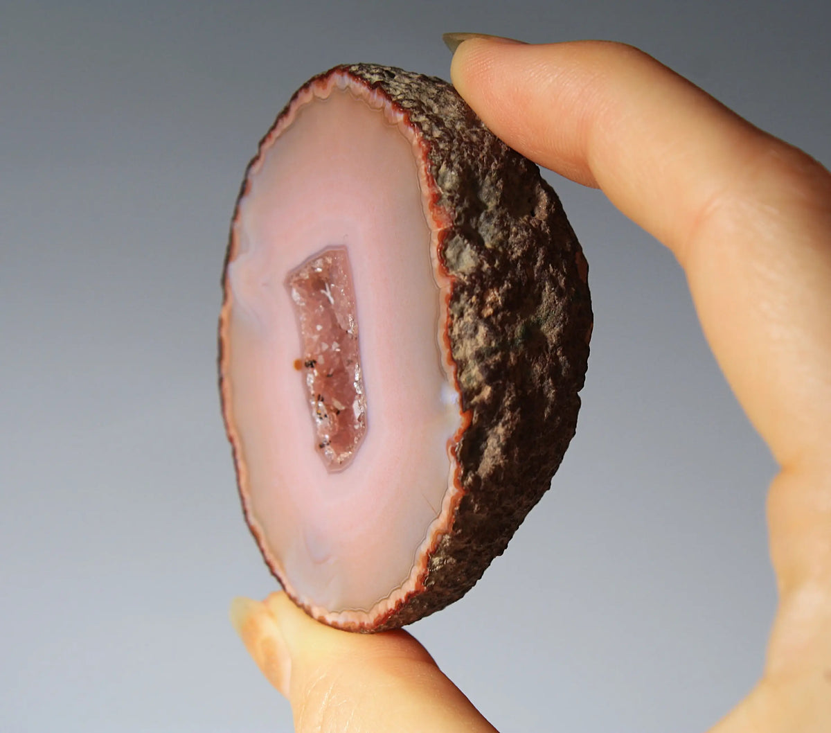 Delicate pink Zhanguo agate pair with layered, gentle bands