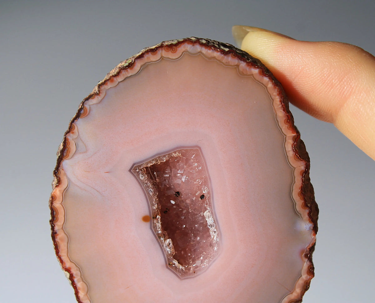 Delicate pink Zhanguo agate pair with layered, gentle bands