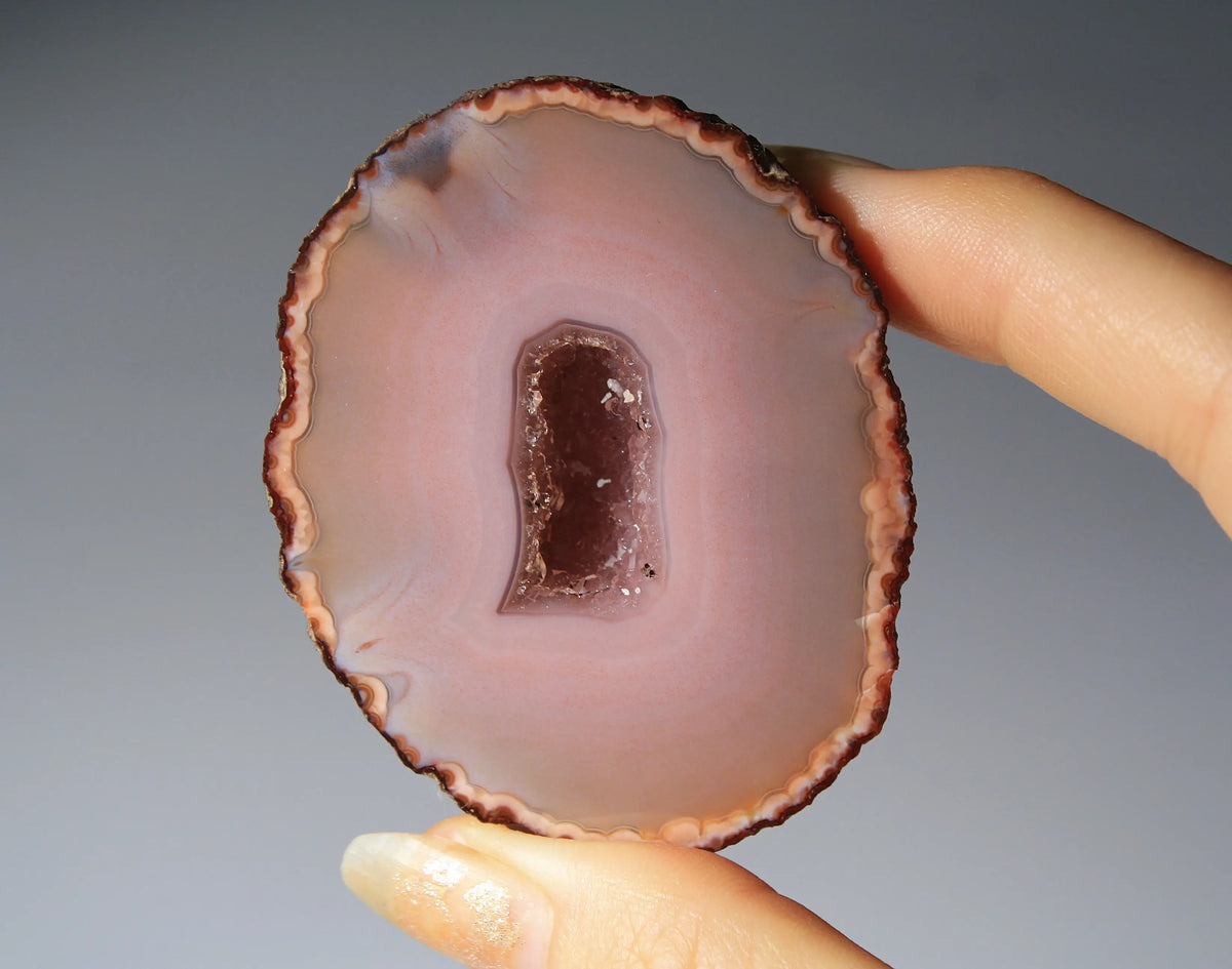Delicate pink Zhanguo agate pair with layered, gentle bands