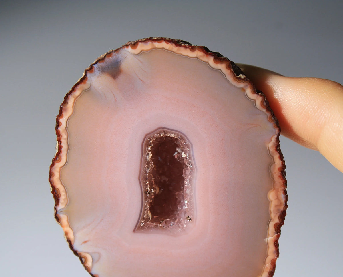 Delicate pink Zhanguo agate pair with layered, gentle bands