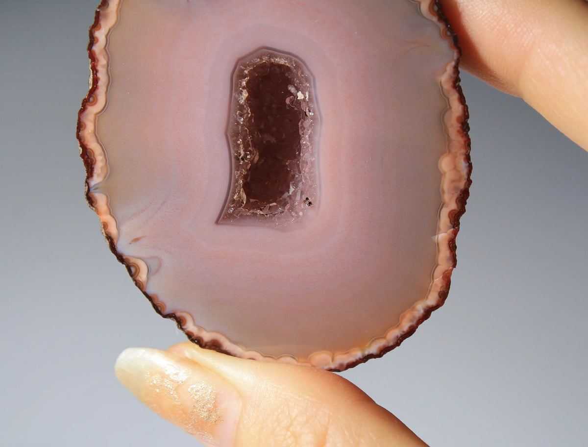Delicate pink Zhanguo agate pair with layered, gentle bands