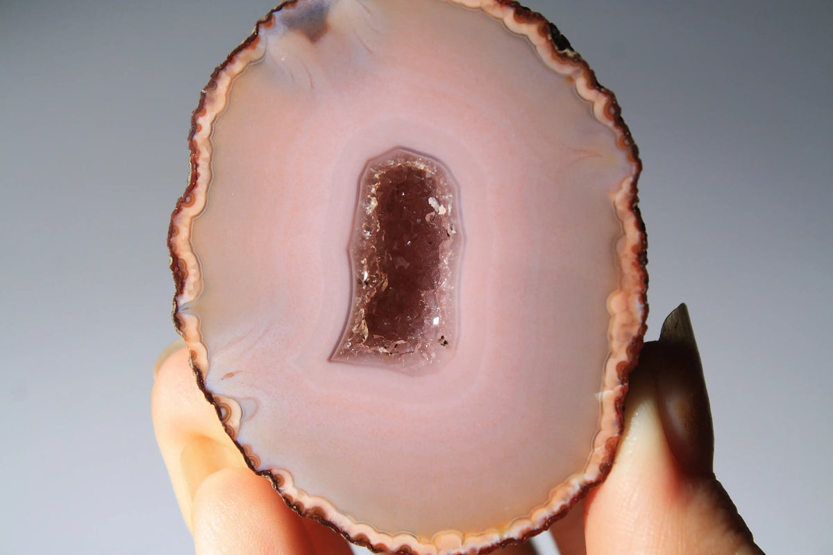 Delicate pink Zhanguo agate pair with layered, gentle bands