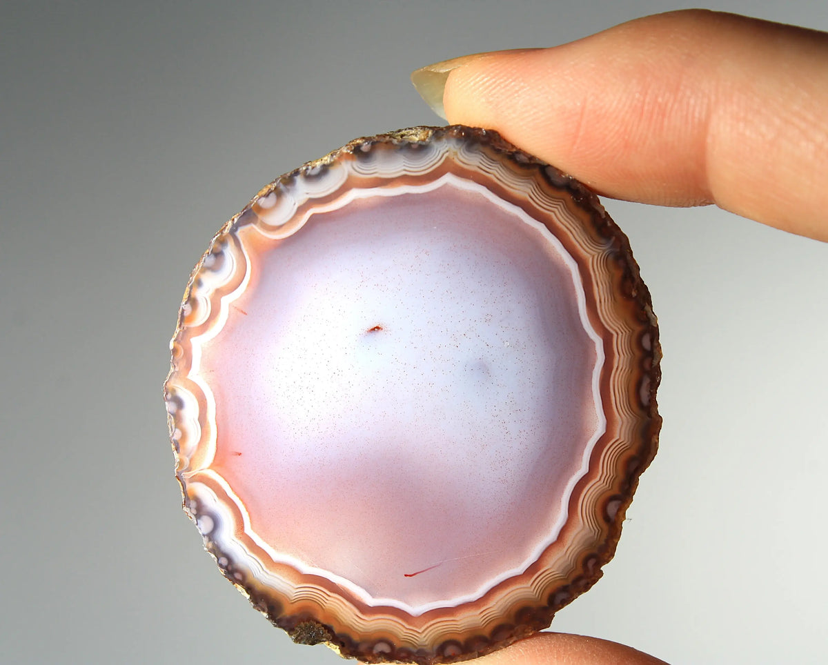 Banded deep purple Zhanguo agate pair with rich, swirling layers