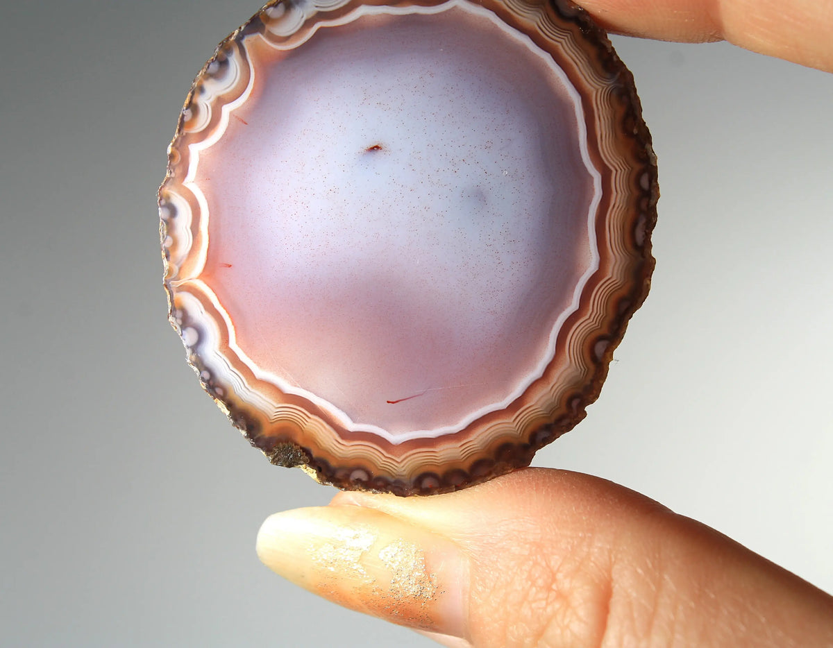 Banded deep purple Zhanguo agate pair with rich, swirling layers