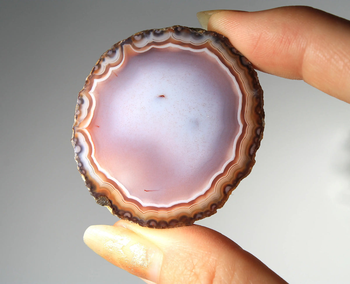 Banded deep purple Zhanguo agate pair with rich, swirling layers