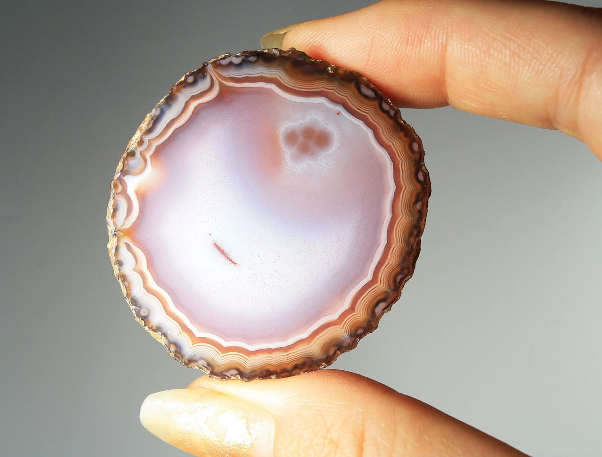 Banded deep purple Zhanguo agate pair with rich, swirling layers