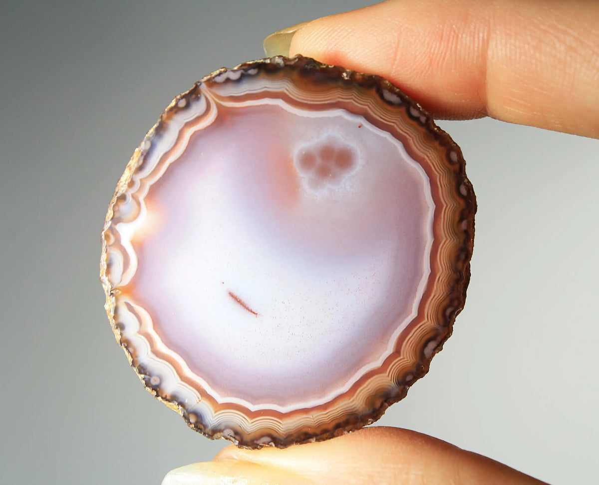 Banded deep purple Zhanguo agate pair with rich, swirling layers