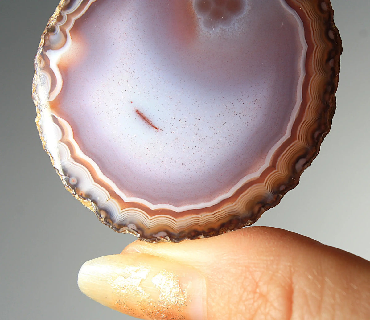 Banded deep purple Zhanguo agate pair with rich, swirling layers