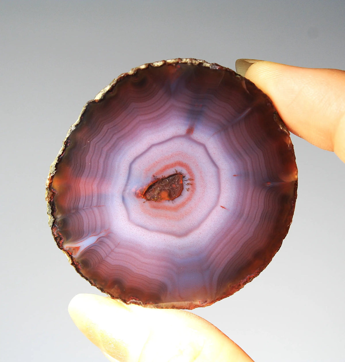 Banded purple Zhanguo agate pair with vivid swirling layers