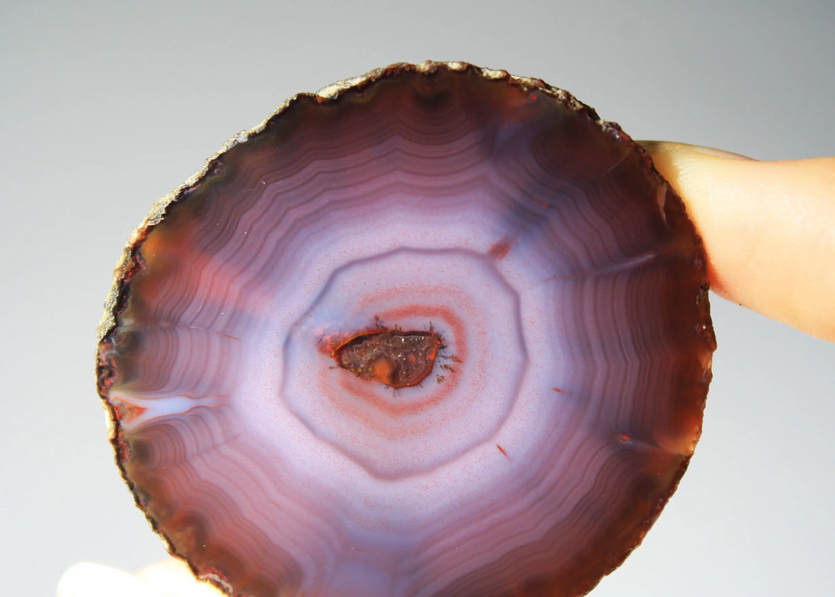 Banded purple Zhanguo agate pair with vivid swirling layers