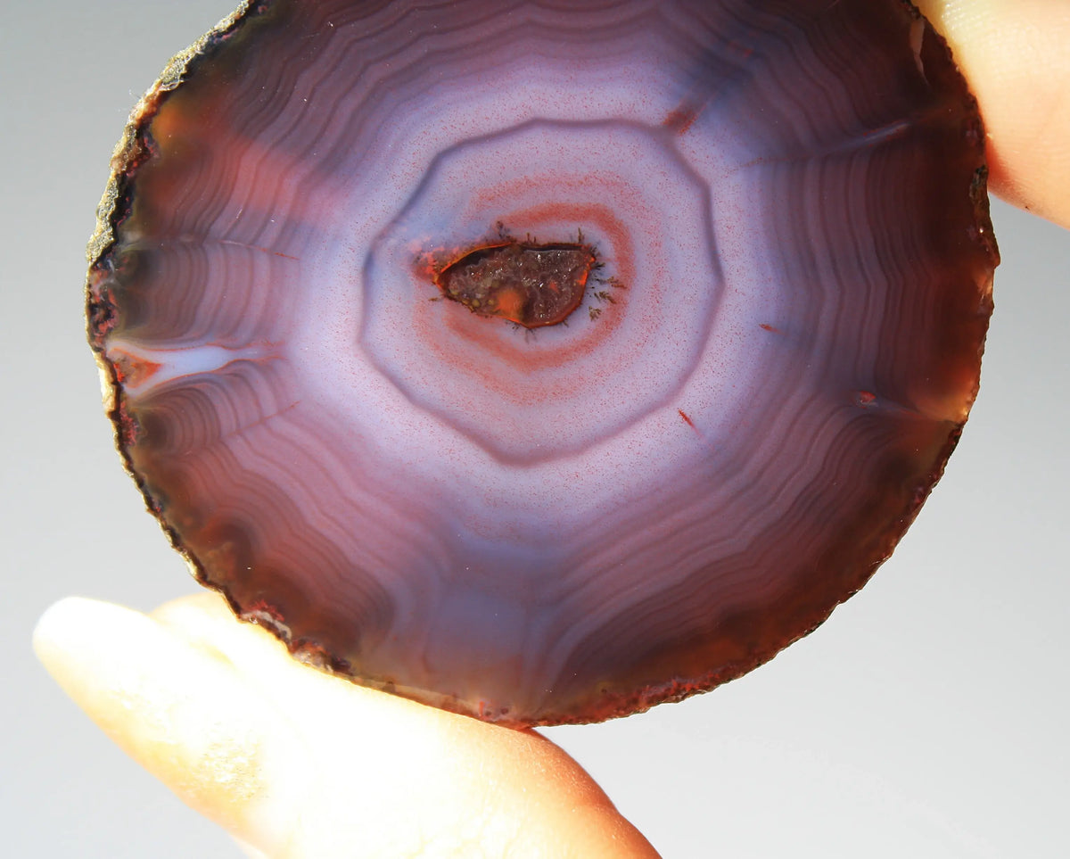 Banded purple Zhanguo agate pair with vivid swirling layers