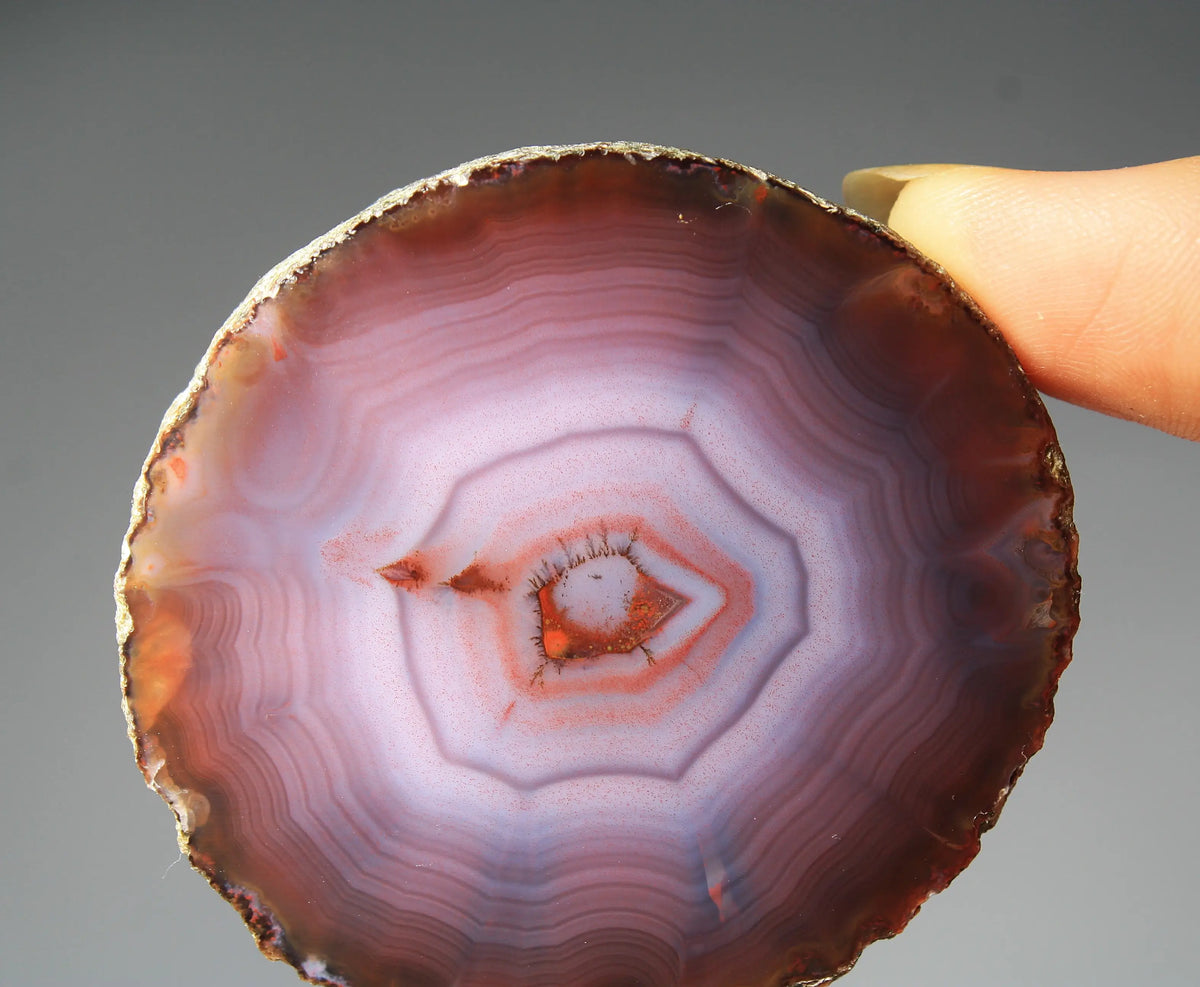Banded purple Zhanguo agate pair with vivid swirling layers