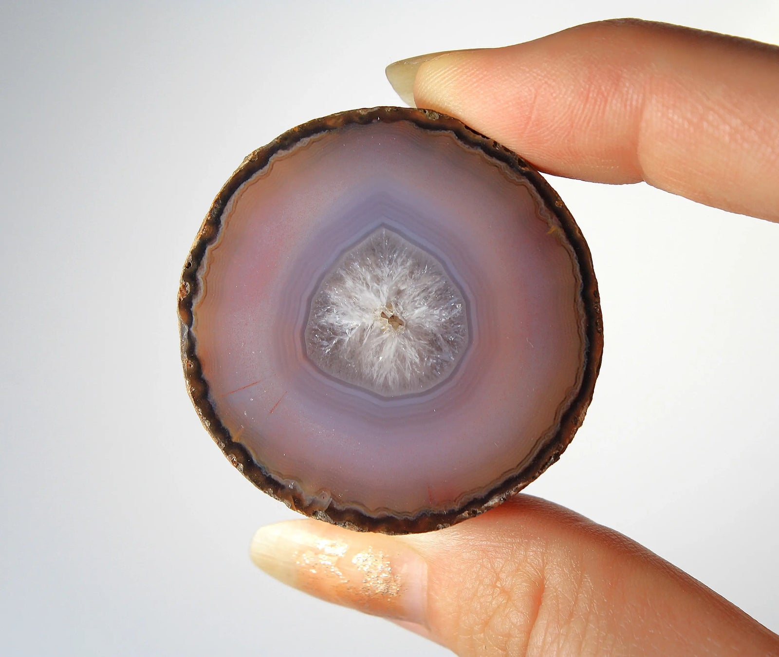 Mystical purple Zhanguo agate pair with layered, luminous patterns