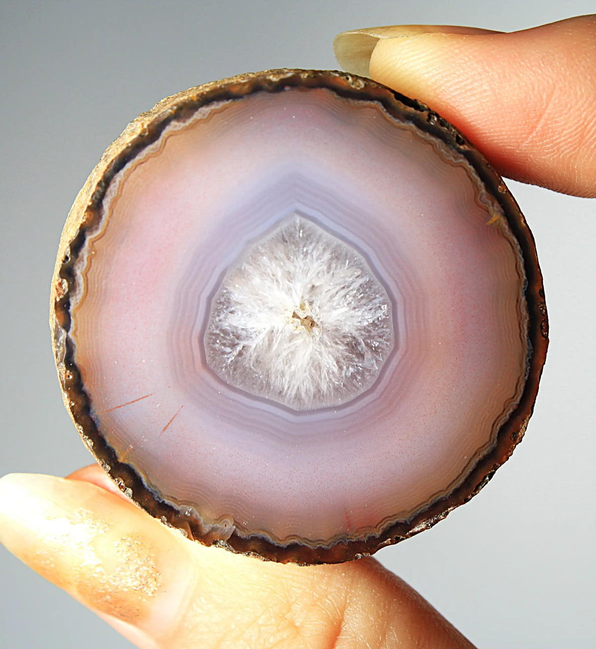 Mystical purple Zhanguo agate pair with layered, luminous patterns