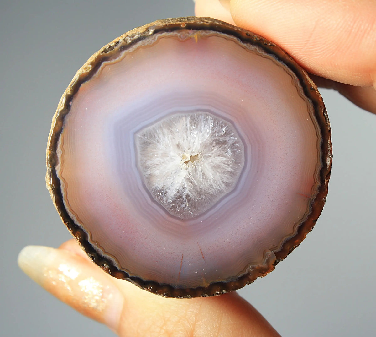 Mystical purple Zhanguo agate pair with layered, luminous patterns