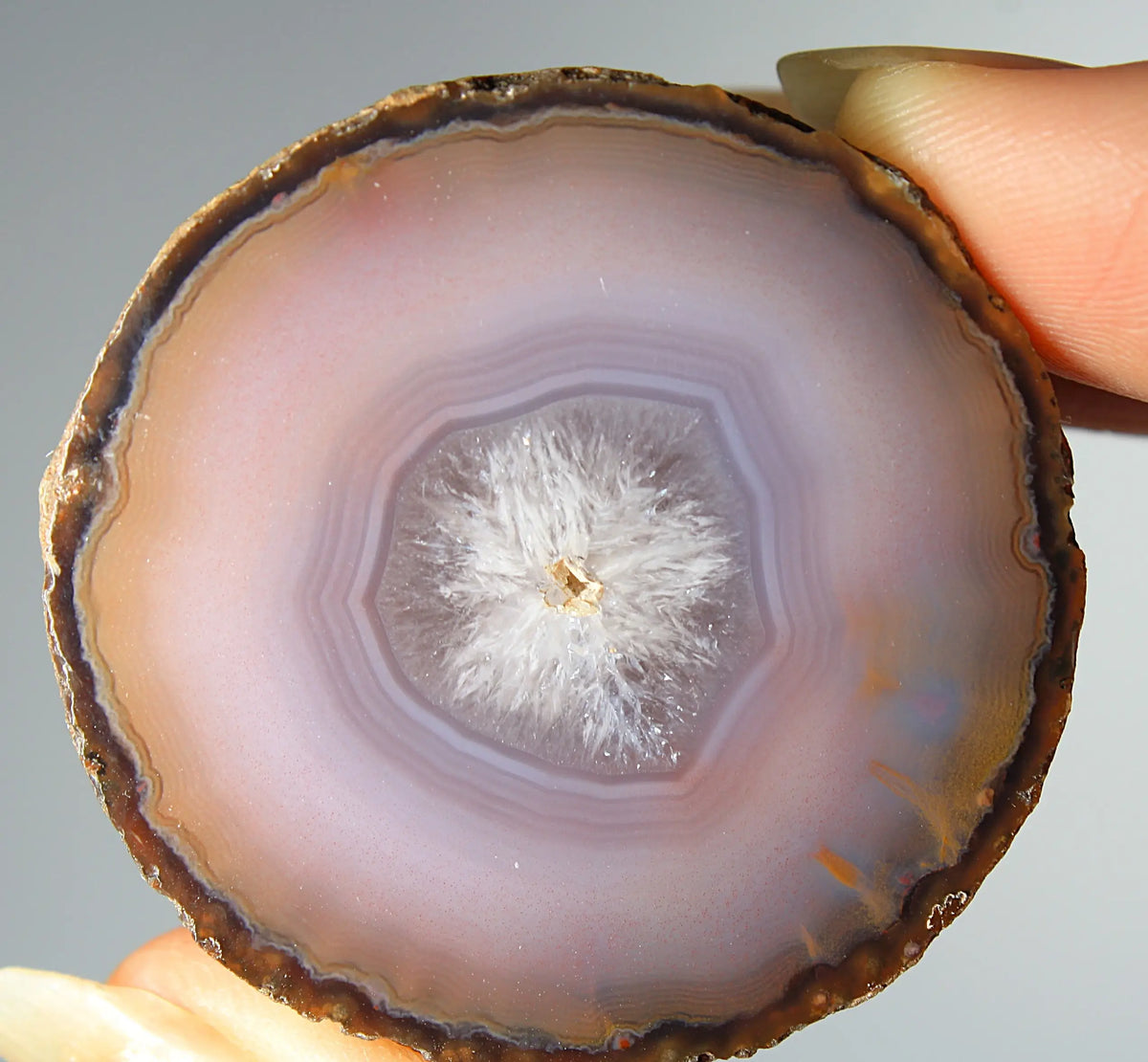 Mystical purple Zhanguo agate pair with layered, luminous patterns