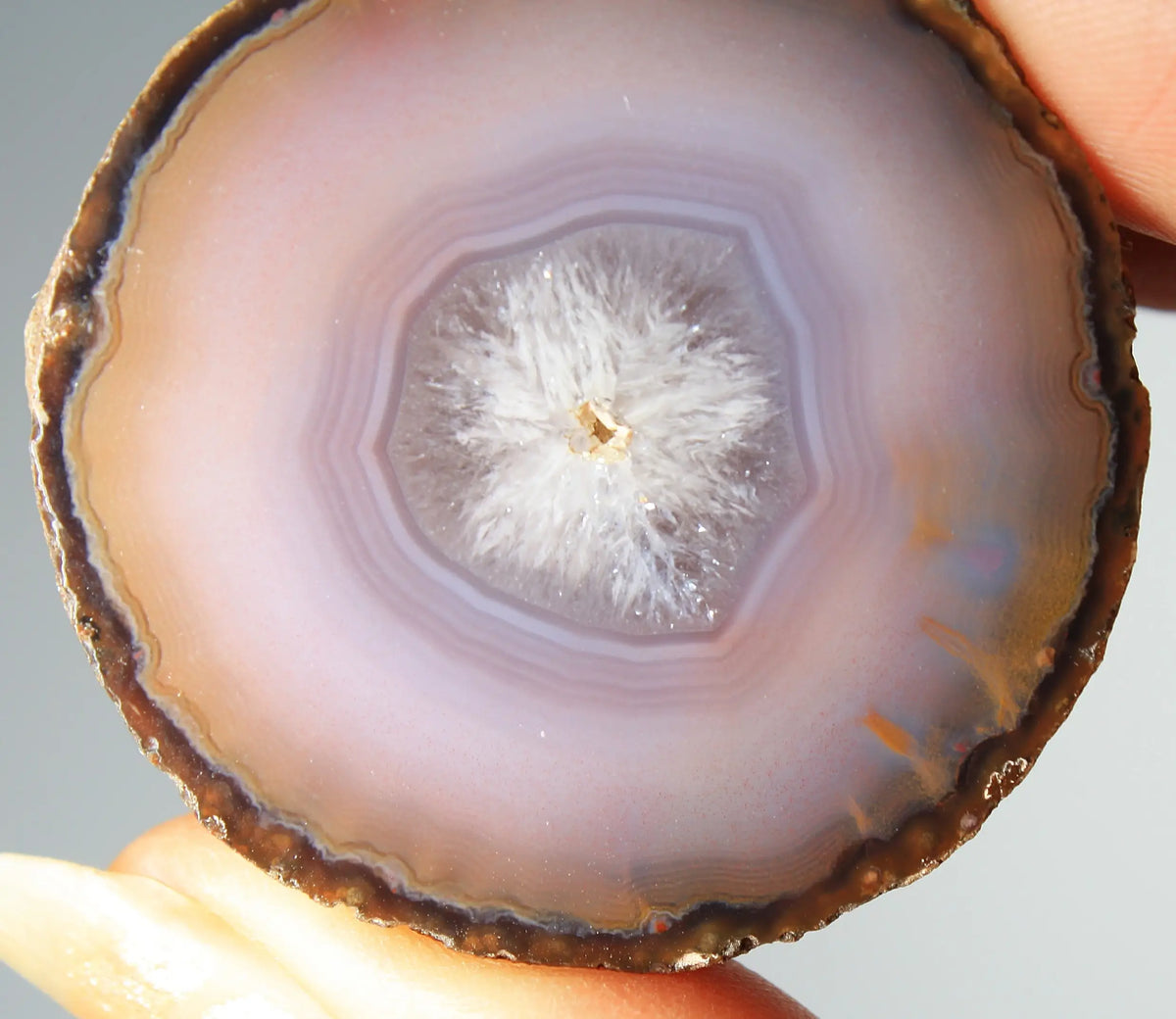 Mystical purple Zhanguo agate pair with layered, luminous patterns