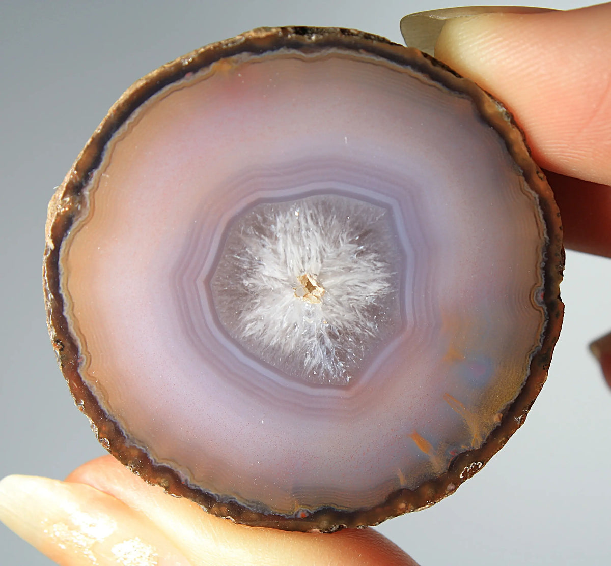 Mystical purple Zhanguo agate pair with layered, luminous patterns