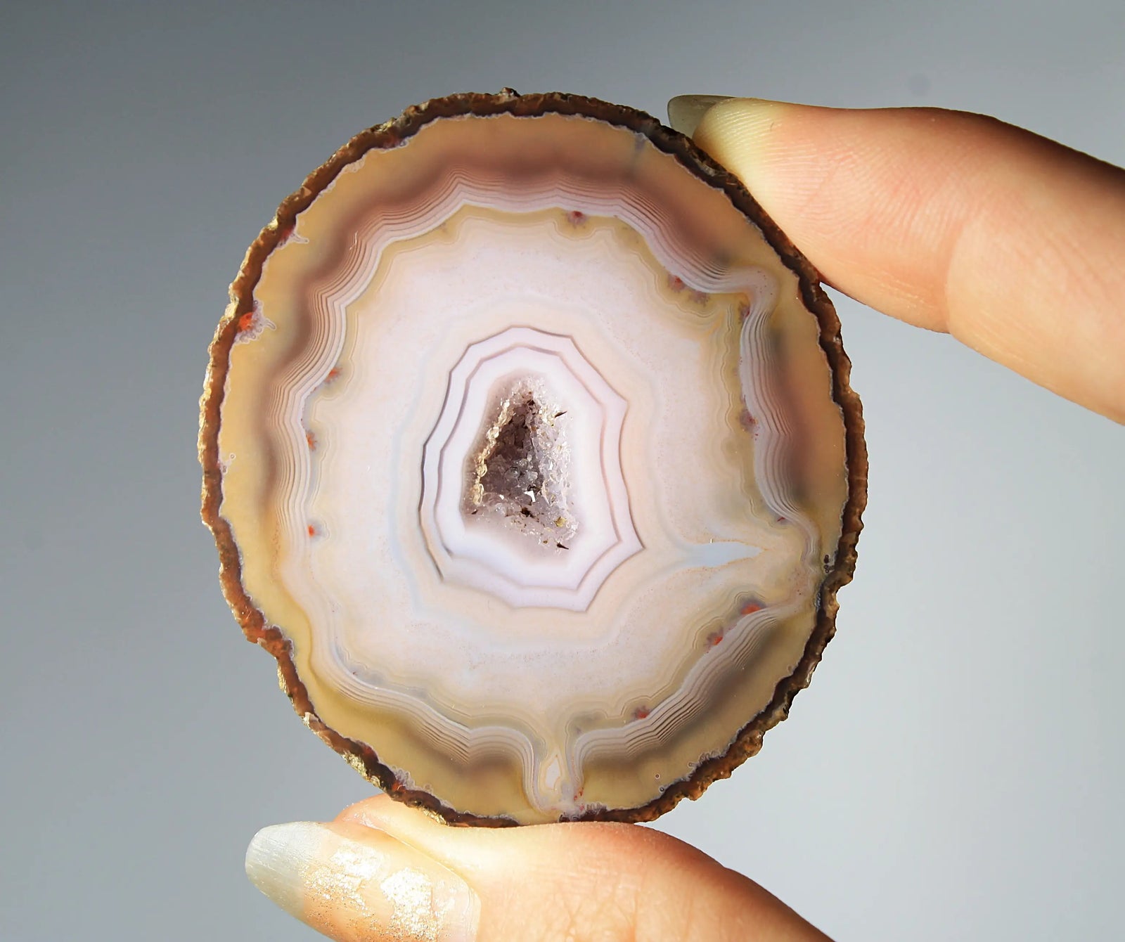 Rare pink Zhanguo agate pair featuring vivid, layered bands