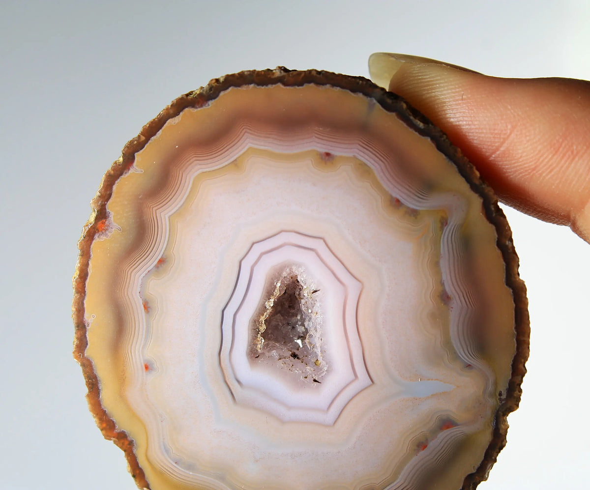 Rare pink Zhanguo agate pair featuring vivid, layered bands