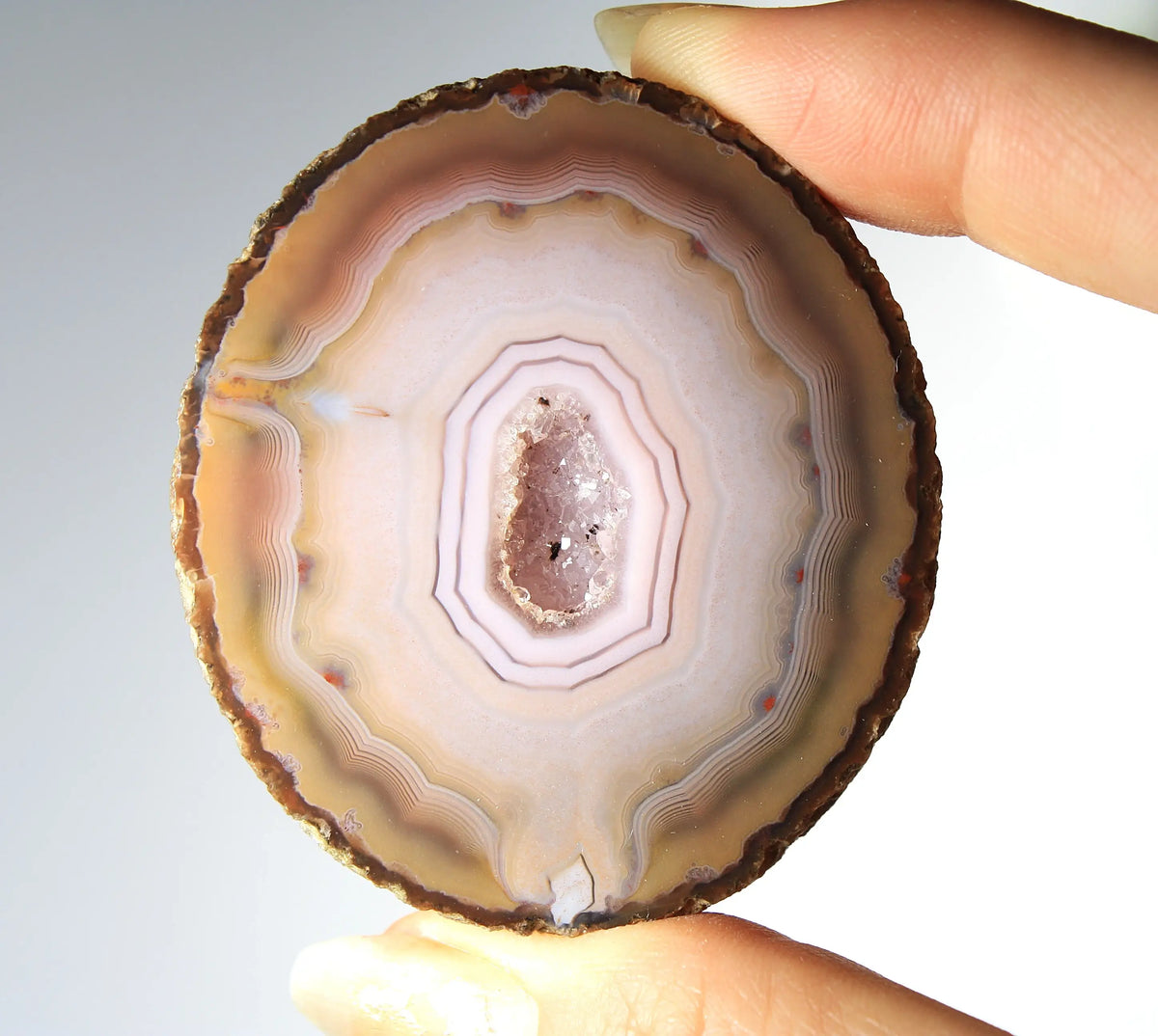 Rare pink Zhanguo agate pair featuring vivid, layered bands