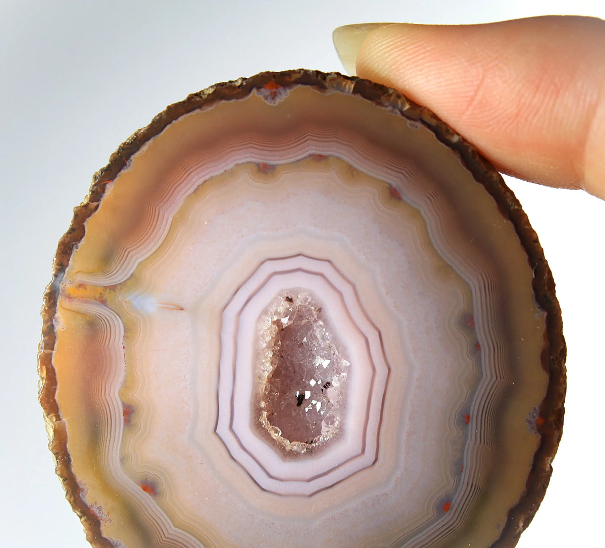 Rare pink Zhanguo agate pair featuring vivid, layered bands