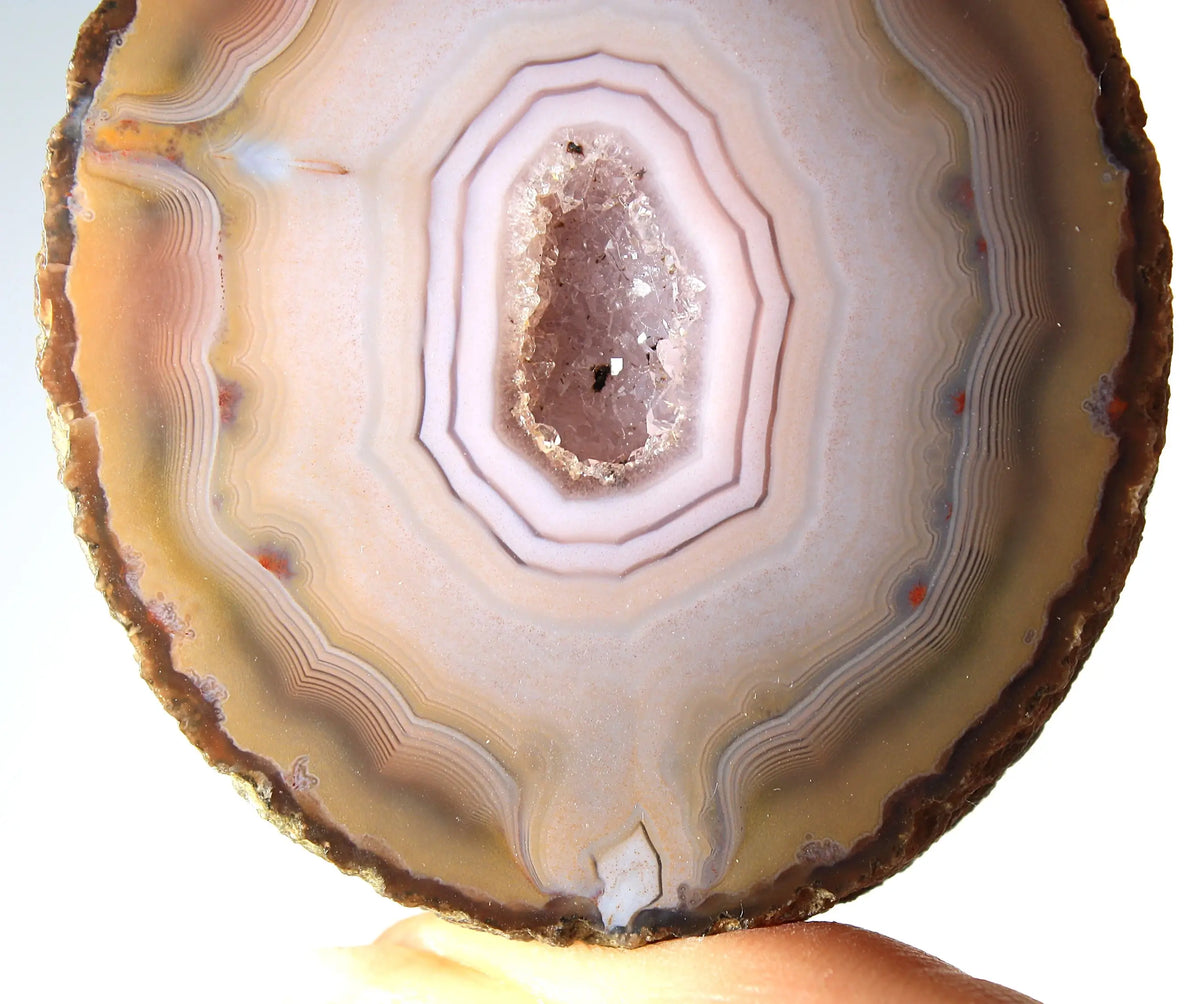 Rare pink Zhanguo agate pair featuring vivid, layered bands
