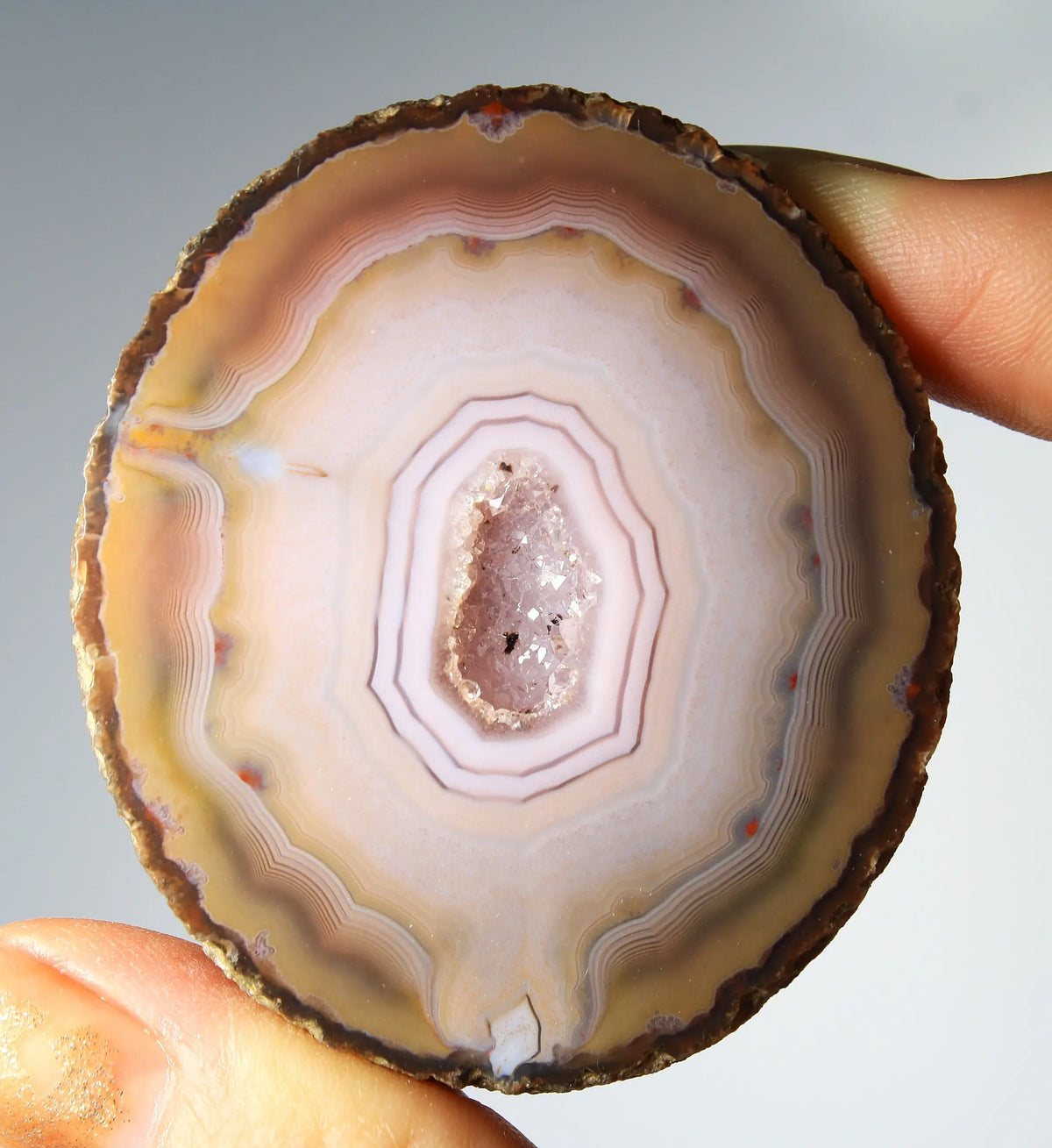 Rare pink Zhanguo agate pair featuring vivid, layered bands