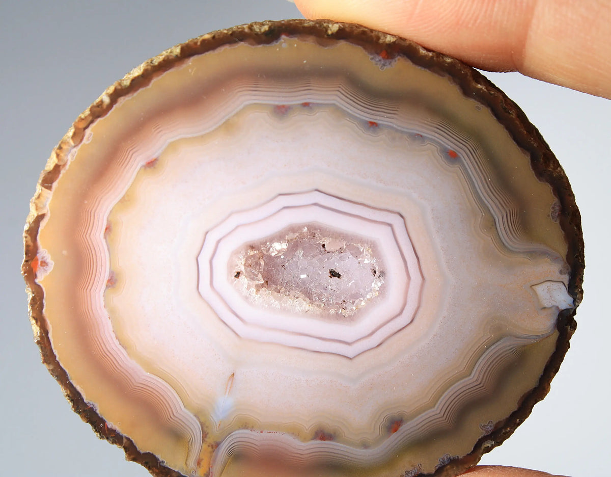 Rare pink Zhanguo agate pair featuring vivid, layered bands
