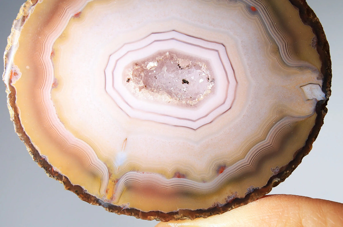 Rare pink Zhanguo agate pair featuring vivid, layered bands