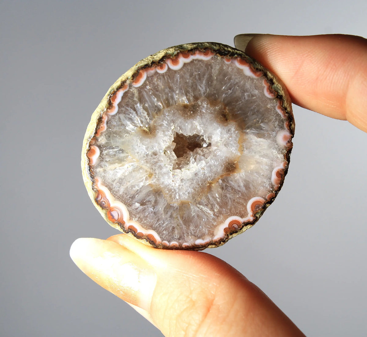 White and orange banded Zhanguo agate pair with a clear crystal core