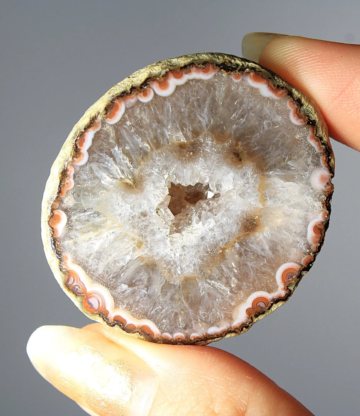 White and orange banded Zhanguo agate pair with a clear crystal core