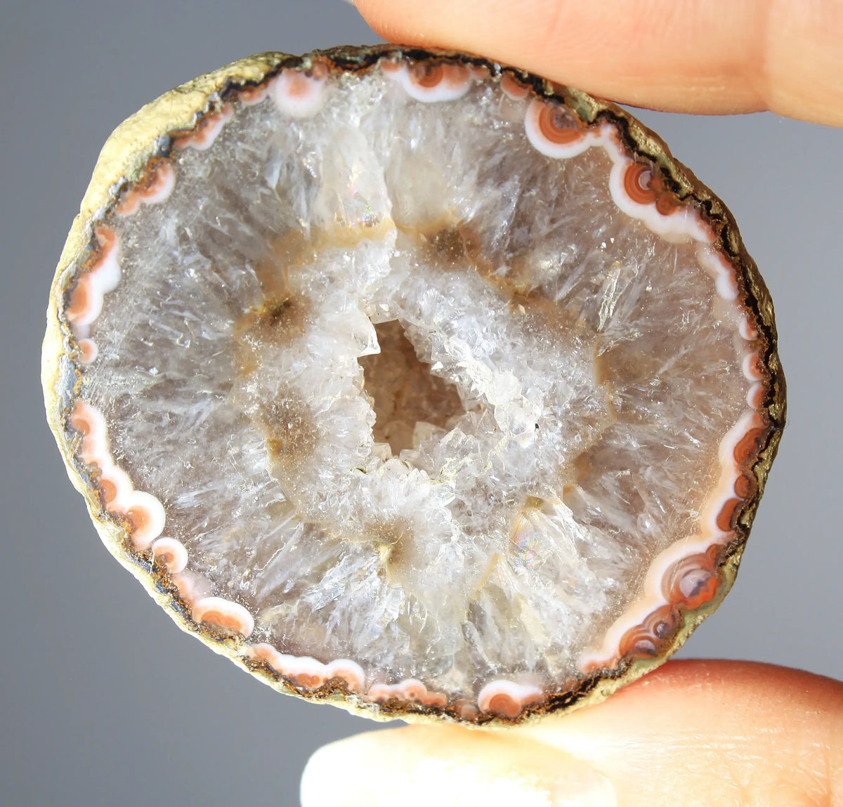 White and orange banded Zhanguo agate pair with a clear crystal core