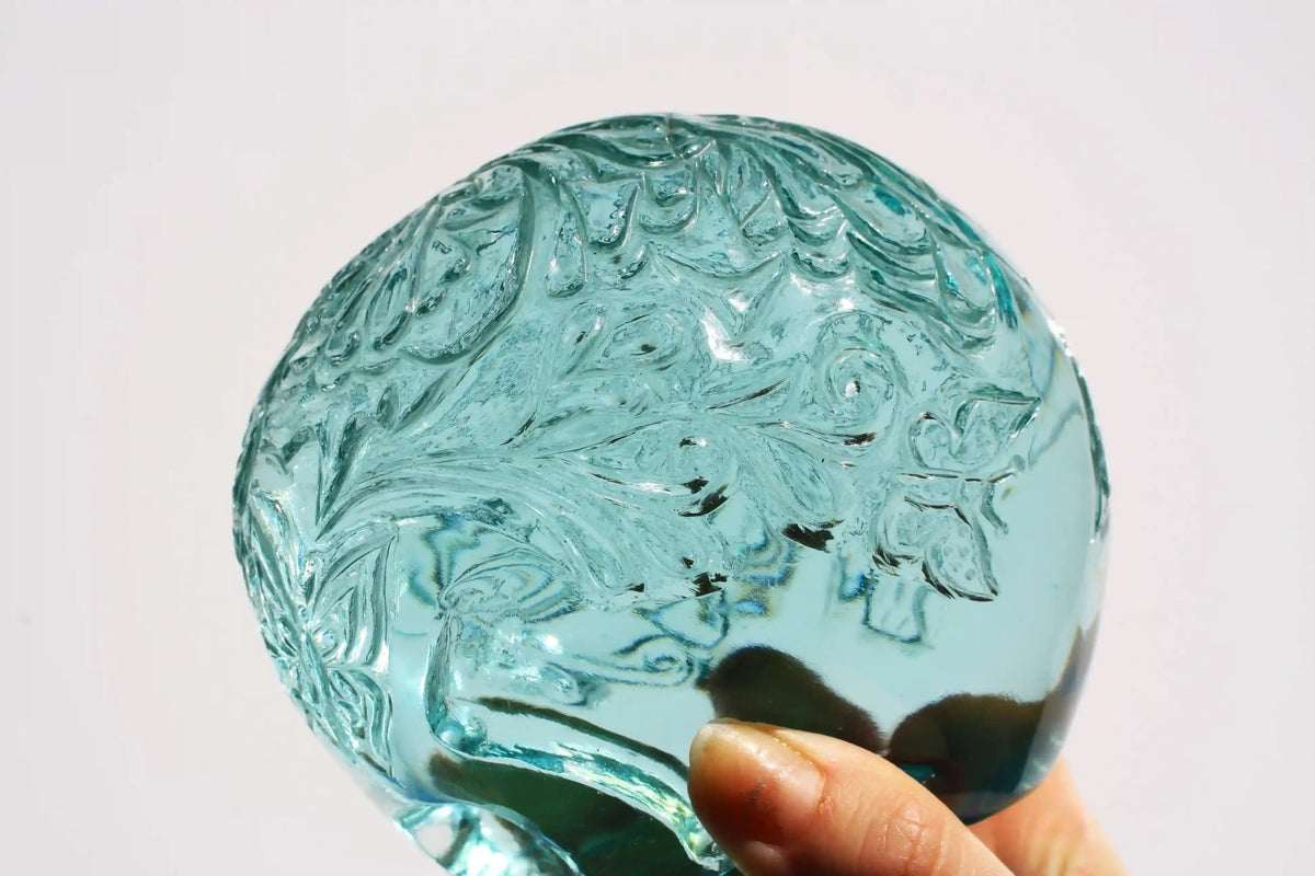 Hand‑carved crystal skull with detailed butterfly engraving by master carver Vikas Meena