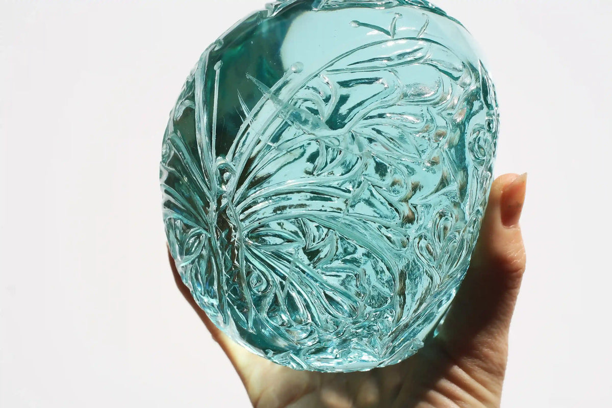 Hand‑carved crystal skull with detailed butterfly engraving by master carver Vikas Meena