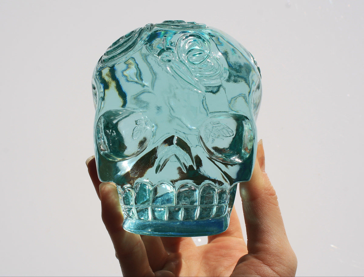 Blue obsidian crystal skull with hand engraved butterfly designs