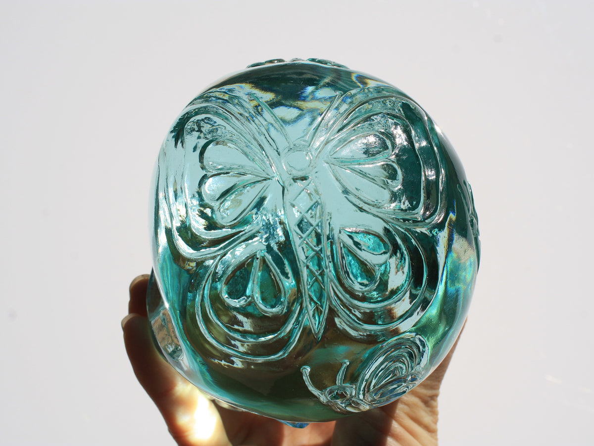 Blue obsidian crystal skull with hand engraved butterfly designs