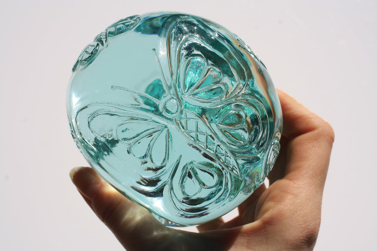 Blue obsidian crystal skull with hand engraved butterfly designs
