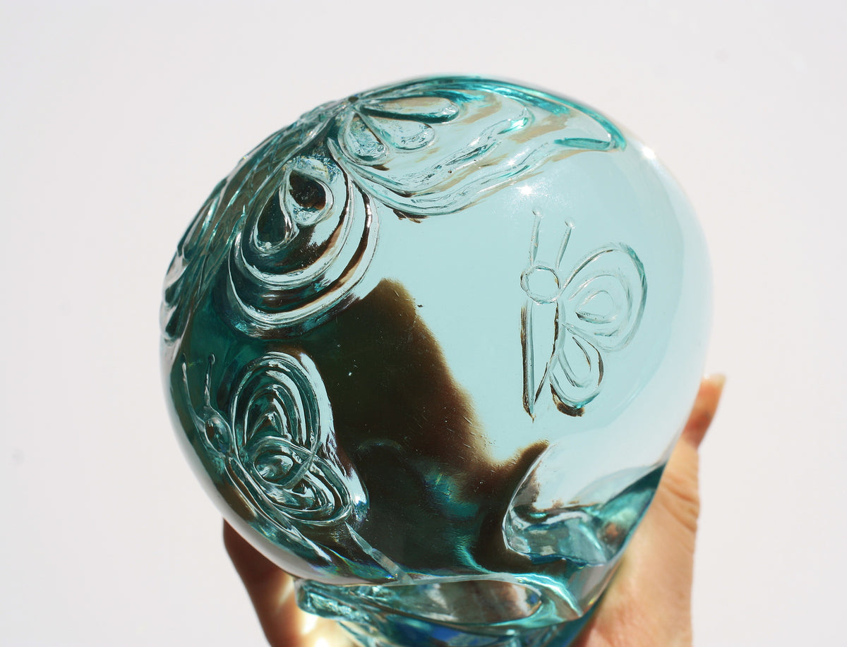 Blue obsidian crystal skull with hand engraved butterfly designs